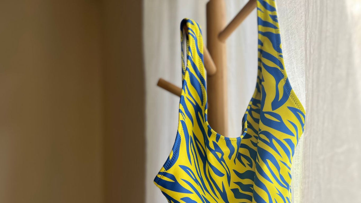animal print one piece swimsuit in neon strips